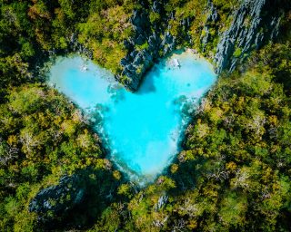 aerial-top-view-of-turquoise-lagoon-shaped-heart-i-2021-08-26-20-17-22-utc.jpg