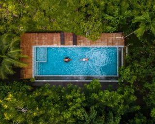 aerial-view-of-swimming-pool-in-the-jungle-of-krab-2022-07-01-03-53-25-utc.jpg